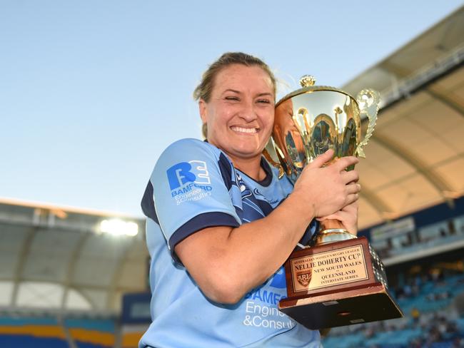 NSW captain Ruan Sims clutches the Nellie Doherty Cup after the Blues Origin win last year.