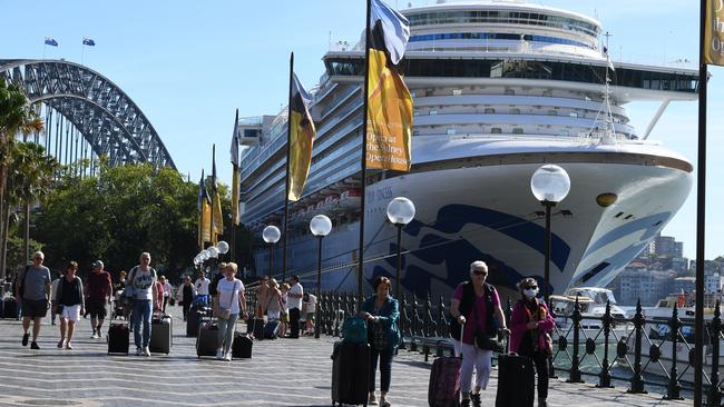 Cruise ship passengers disembark from the Ruby Princess at Circular Quay in Sydney on March 19, with no virus checks. Picture: AAP