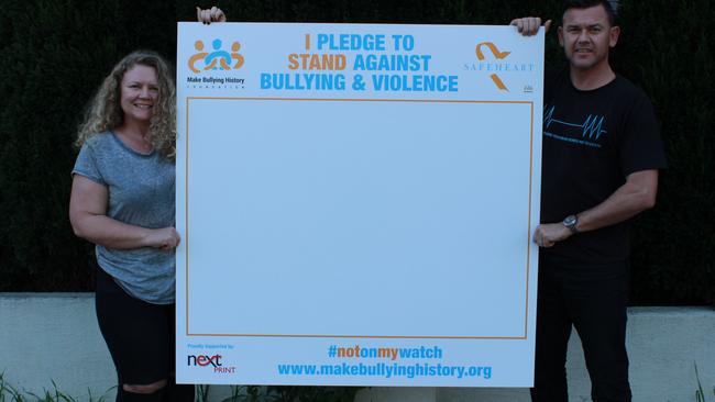 Make Bullying History Foundation executive directors Terrisa and Brett Murray with their pledge, they will launch at the Orange Blossom Festival, for everyone to sign and make a stand against bullying and violence.