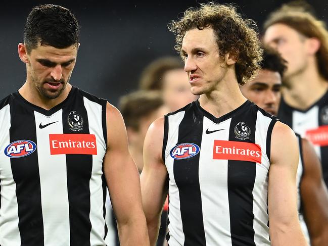 MELBOURNE, AUSTRALIA - APRIL 10: Scott Pendlebury and Chris Mayne of the Magpies look dejected after losing the round four AFL match between the Collingwood Magpies and the Greater Western Sydney Giants at Melbourne Cricket Ground on April 10, 2021 in Melbourne, Australia. (Photo by Quinn Rooney/Getty Images)