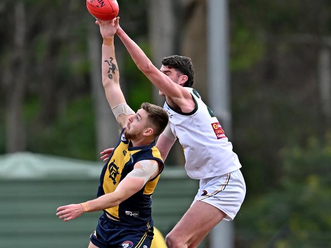 Tom Hallebone (right) rucks for Northcote Park against Hurstbridge’s Aidan Clarke. Picture: Andy Brownbill