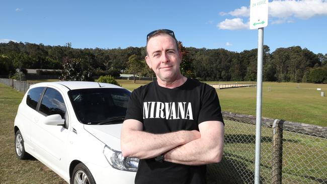 Nick Flanagan at Pioneer Downs Park with the new parking signs. Picture Glenn Hampson