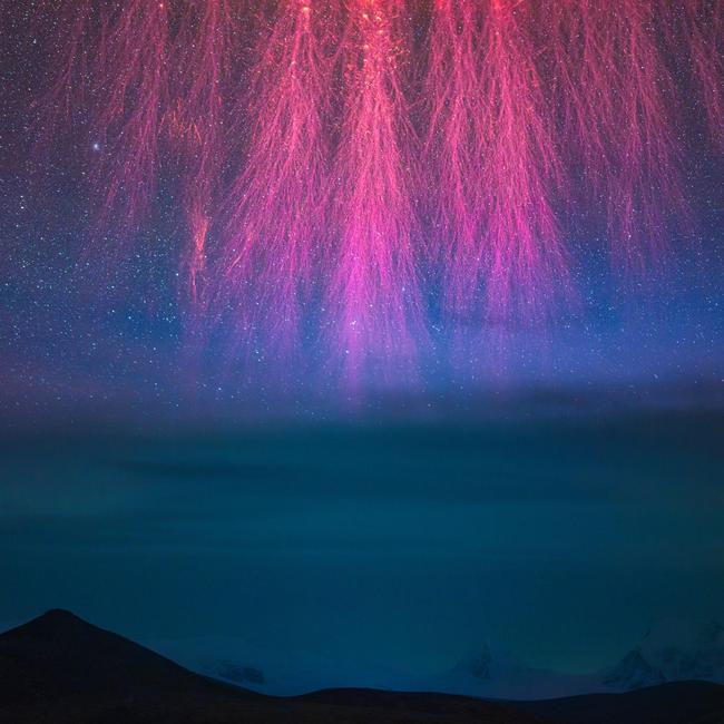 Grand Cosmic Fireworks by Angel An. This image was the winner in the Skyscapes category. Sprites are an extremely rare phenomenon of atmospheric luminescence that shoot into the upper reaches of the atmosphere, appearing like fireworks. The photographer captured this from the highest ridge of the Himalaya mountains.