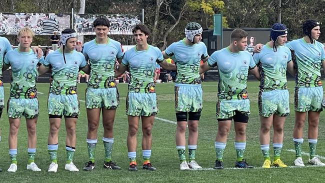 James Martens, middle with no head gear, with teammates ahead of kick-off.