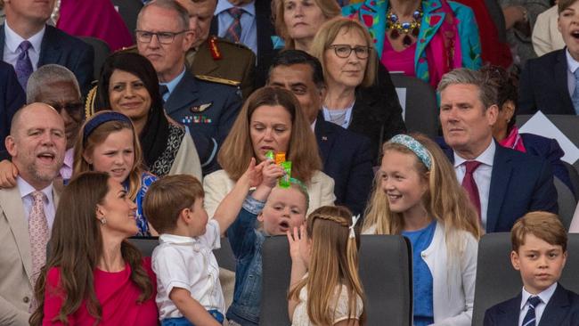 Mike Tindall, Mia Tindall, Lena Tindall and Savannah Phillips; Front: (L-R) Prince Louis, Kate, Duchess of Cambridge, Princess Charlotte and Prince George at the Platinum Pageant. Picture: Roland Hoskins/WPA/Getty Images.