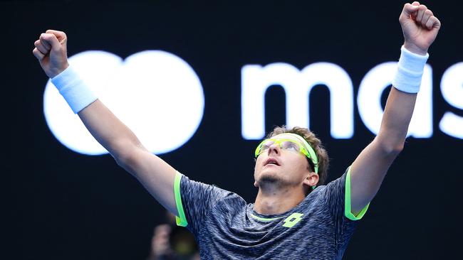 Denis Istomin celebrates his upset win against Novak Djokovic. Picture: Mark Stewart