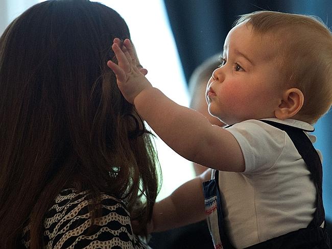 He loves his mother’s hair. Well, he hasn’t much to play with on dad’s roof.  