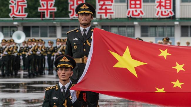 Members of the Chinese People's Liberation Army at a flag-raising ceremony in Hong Kong. Picture: Getty Images