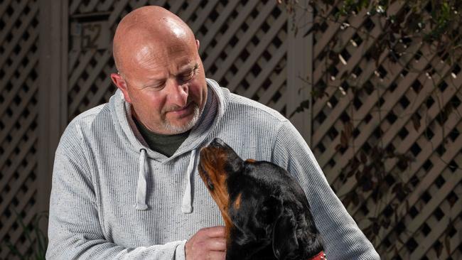 A Edwardstown house fire at the end of August that took the life of a dog, continues to be felt in the neighbourhood with the next door neighbour, Peter Longobardi, with breathing difficulties. He is pictured with his assistance dog Calli. Picture: Naomi Jellicoe