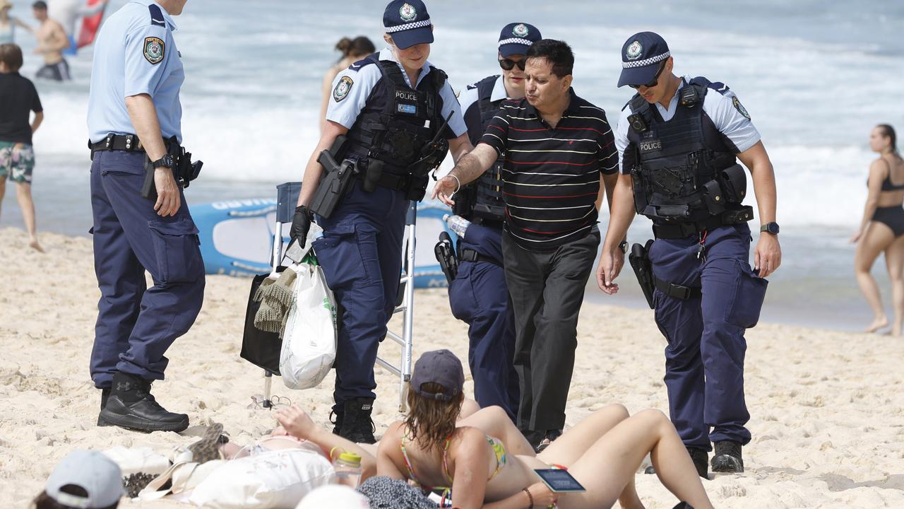 Lewd-photo accused banned from beaches