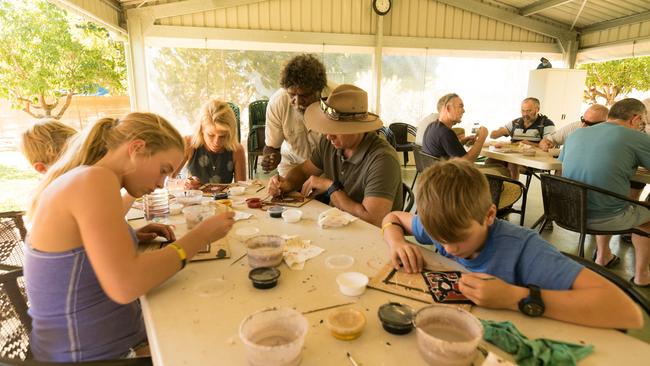 At Top Didj Cultural Experience and Art Gallery visitors enjoy authentic Aboriginal cultural experiences with Top End Aboriginal artist Manuel Pamkal. Picture: Supplied