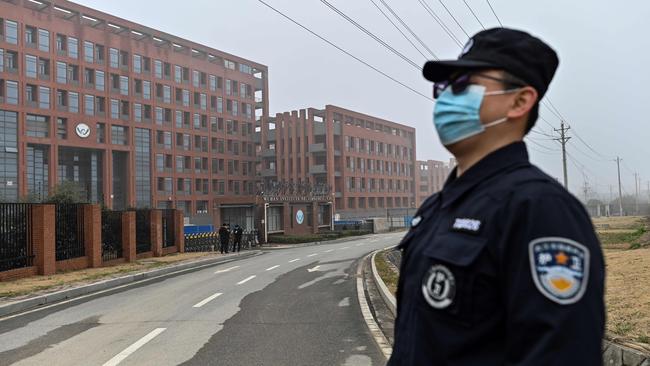 A security personnel stands guard as members of the World Health Organisation (WHO) team investigating the origins of the COVID-19 coronavirus. Picture: AFP