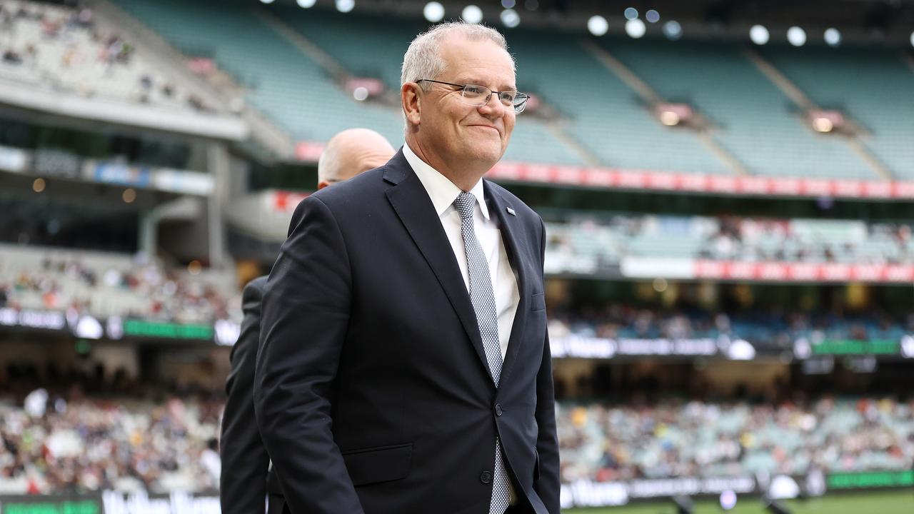 Scott Morrison smiles as he walks on to the MCG. Photo by Michael Klein