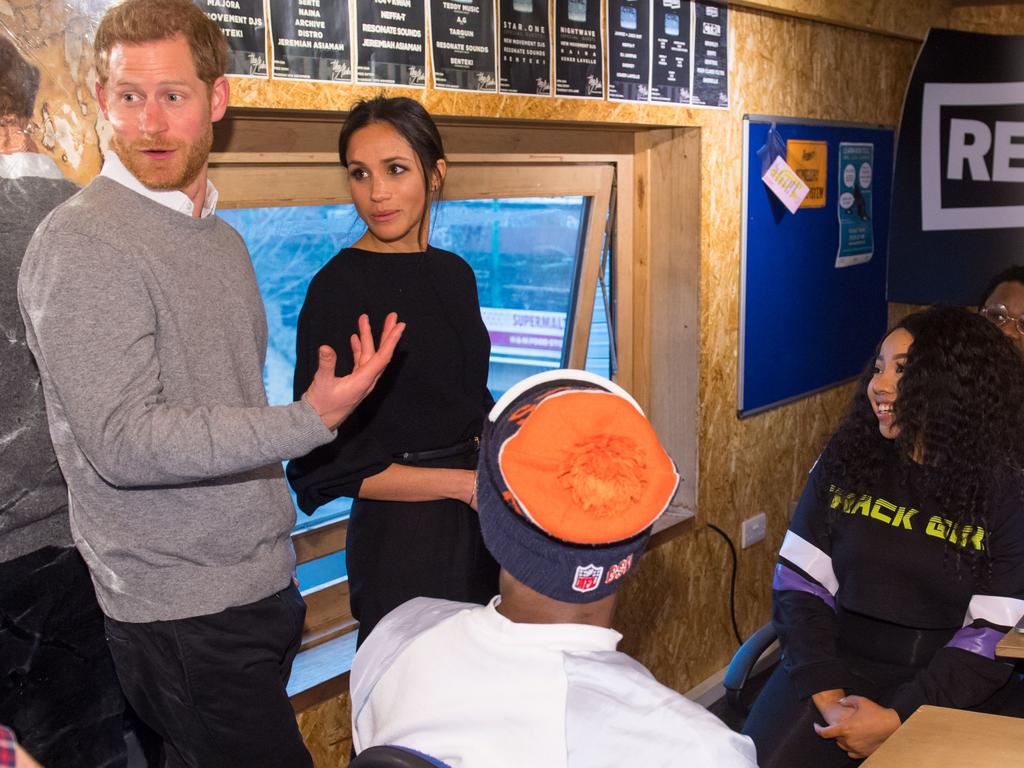 Britain’s Prince Harry (L) and fiancée US actress Meghan Markle (2nd L) visit Reprezent 107.3FM community radio station in Brixton, south west London on January 9, 2018. During their visit to the station, they met some of the presenters, content producers and staff, heard more about their training programmes, and met some of the current and former volunteers who have benefitted from the training. Picture: AFP