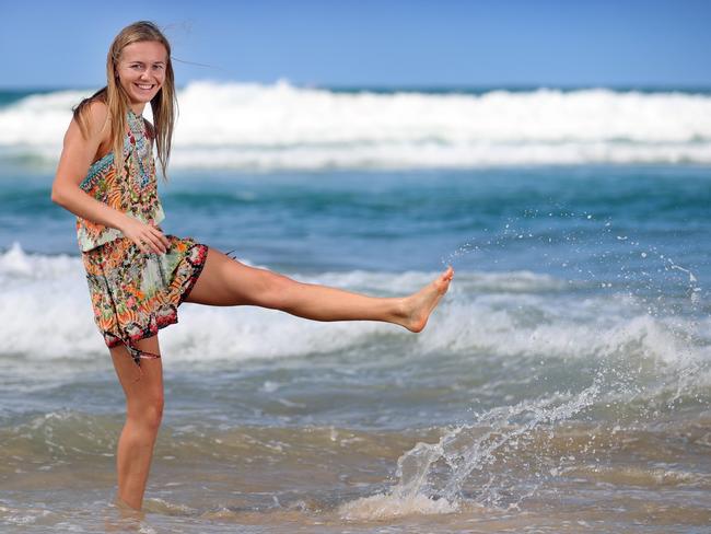 Ariarne Titmus kicks up her heels in the surf in Broadbeach. Picture: Alex Coppel