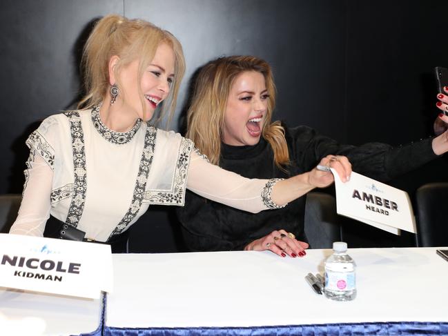 Nicole Kidman and Amber Heard take a selfie at DC Entertainment's Warner Bros. Pictures 'Aquaman' Autograph Signing during Comic-Con International 2018 at San Diego Convention Center. Photo by Joe Scarnici/Getty Images