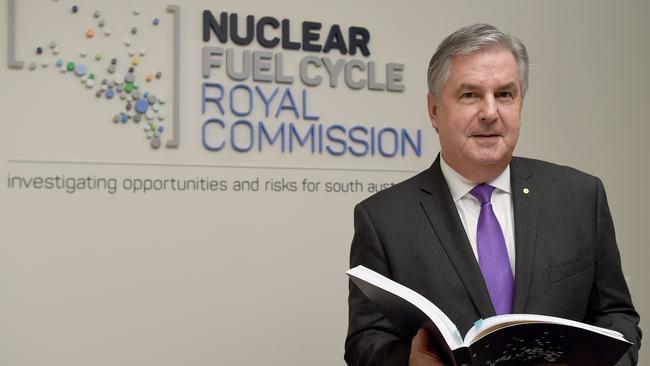 Royal Commissioner Kevin Scarce with his final nuclear fuel cycle report. Picture: Naomi Jellicoe