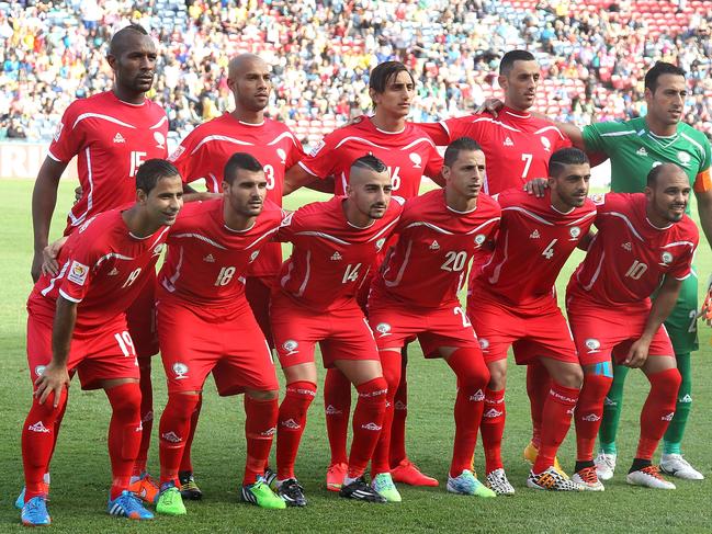 NEWCASTLE, AUSTRALIA - JANUARY 12: Palestine players line up before the match during the 2015 Asian Cup match between Japan and Palestine at Hunter Stadium on January 12, 2015 in Newcastle, Australia. (Photo by Tony Feder/Getty Images)