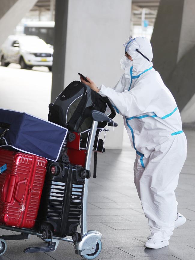 A passenger arrives kitted out to avoid any possible contamination. Picture John Grainger