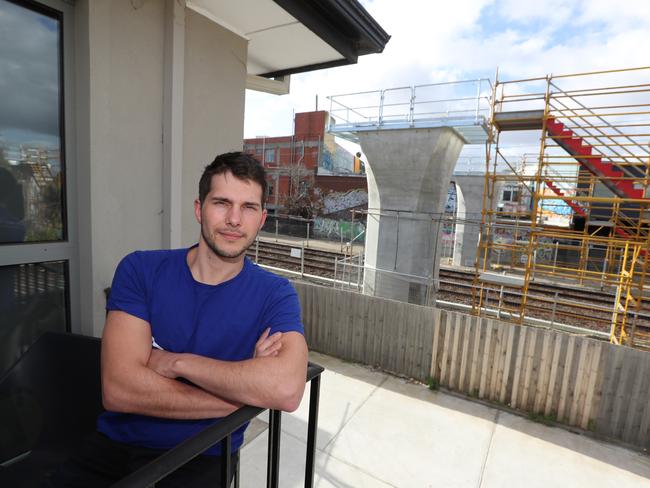 Carnegie resident Timothy Osborn in front his new concrete pylon view. Picture: Alex Coppel