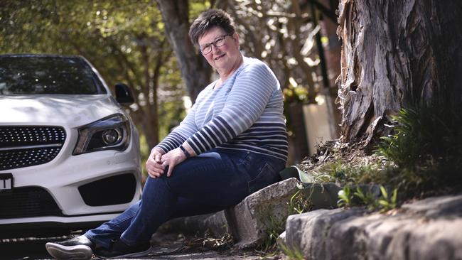 Mary-Helen Ward on Loftus St, Leichhardt where tree roots have dislodged the kerb. (AAP IMAGE -Flavio Brancaleone)