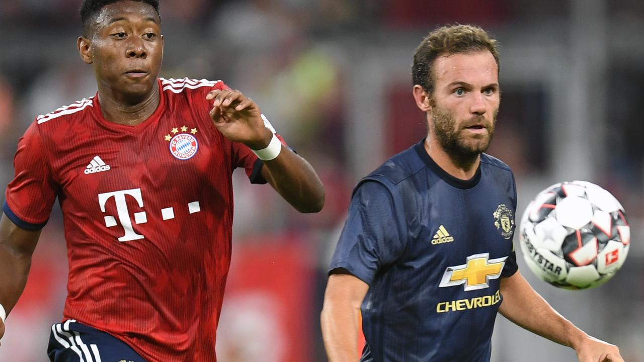 Bayern Munich's Austrian defender David Alaba (L) vies with Manchester's Spanish midfielder Juan Mata (R)  uring a friendly football match between FC Bayern Munich and Manchester United in Munich, southern Germany, on August 5, 2018. / AFP PHOTO / Christof STACHE