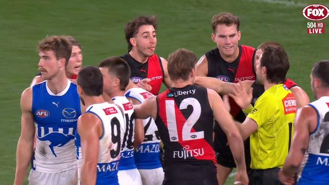 Essendon players thought it should have been a free kick to them. Photo: Fox Footy.