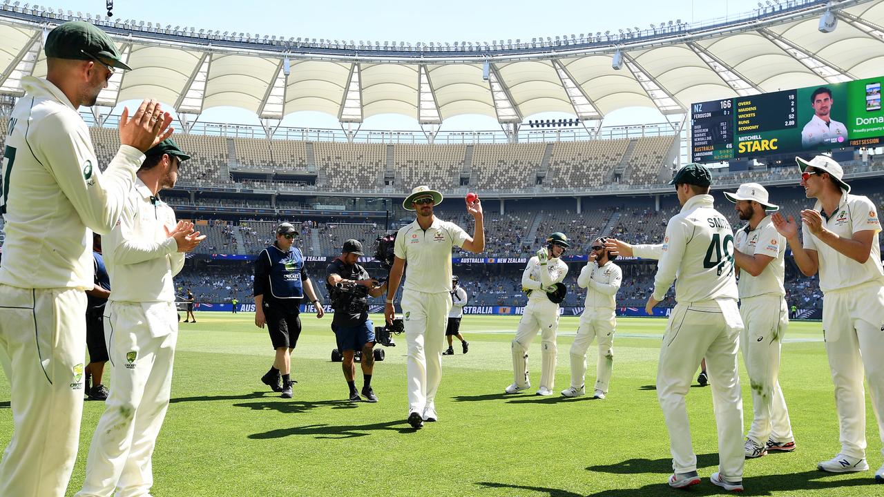 Mitchell Starc is applauded from the field on day three after taking five wickets.