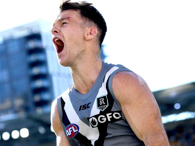 Robbie Gray celebrates after kicking the matchwinning goal, after the siren, to sink Carlton on Sunday. Picture: Bradley Kanaris/Getty Images