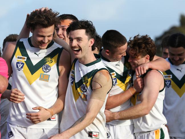 GFL preliminary finals Senior footy: Newtown &amp; Chilwell v Leopold. Leopold's Connor Giddings (left, no 18) kicked the winning goal after he siren and celebrates with the team. Picture: Mike Dugdale