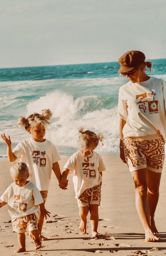 Salty Shreds owner and designer Ashley Reynolds with her children, Bryxton, 4, Ziggy, 2, and Ocean, 1. Picture: Contributed