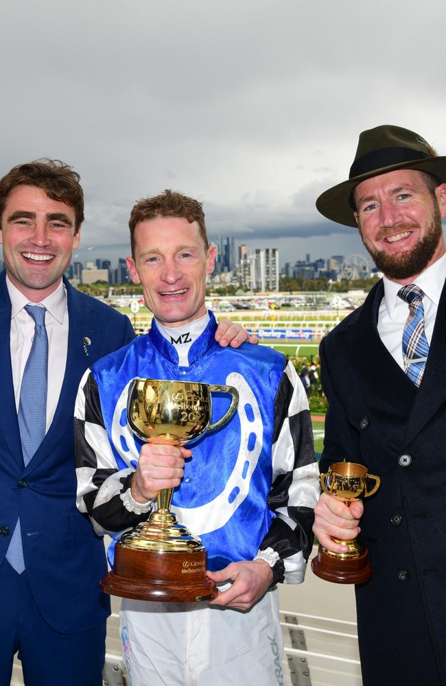 Trainers David Eustace, Ciaron Maher and jockey Mark Zahra pose with the Melbourne Cup after Gold Trip’s victory. Photo: Vince Caligiuri/Getty Images