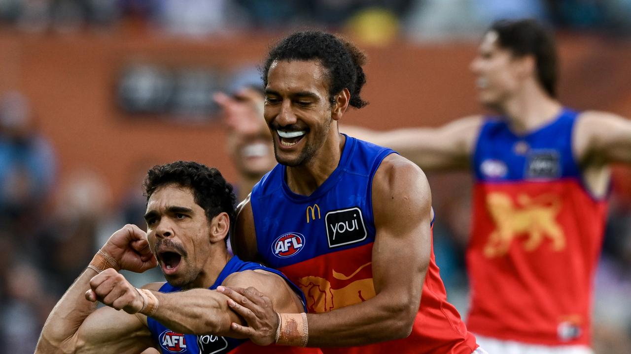 ADELAIDE, AUSTRALIA - JUNE 22: Charlie Cameron of the Lions celebrates a goal with Bruce Reville of the Lions during the round 15 AFL match between Port Adelaide Power and Brisbane Lions at Adelaide Oval, on June 22, 2024, in Adelaide, Australia. (Photo by Mark Brake/Getty Images)