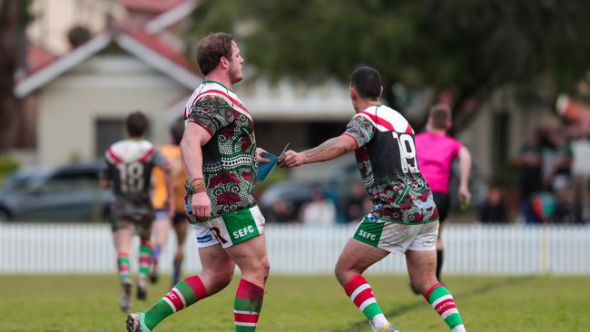 George Burgess interchanges with Damon Alley-Tovio for a well earned rest. Picture: Adam Wrightson Photography