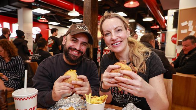 Santino and Mardi were among the first to get their hands on a Five Guys burger. Picture: Justin Lloyd