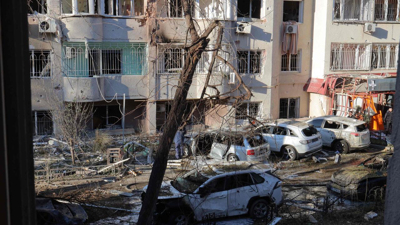 Local residents inspect damage to a residential building and cars following a missile attack in Odessa on November 18, 2024. Picture: Oleksandr Gimanov / AFP