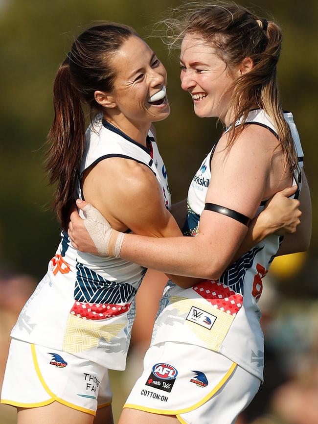 Crows rookie Ailish Considine (right) celebrates her first AFLW goal with teammate Sophie Li. Picture: Michael Willson/AFL Media