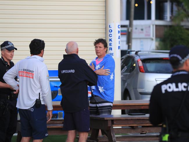 Shocked surfers, lifeguards and police try to comprehend the tragedy. Picture: Scott Powick