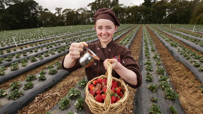 Mornington Peninsula Chocolaterie and Ice Cream’s Anna Guinet adds chocolate to strawberries from Sunny Ridge Strawberry Farm. Picture: Norm Oorloff