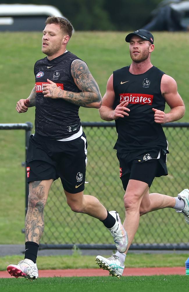 Jordan De Goey (left) will return for Collingwood against Adelaide on Saturday but Tom Mitchell will remain sidelined for at least another week. Picture: Quinn Rooney / Getty Images