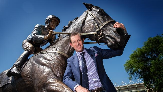 Hugh Bowman with the Winx statue which was unveiled at Moonee Valley on Cox Plate Day. Picture: Tony Gough