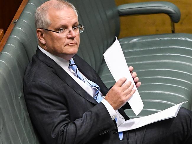 Australian Prime Minister Scott Morrison reacts during House of Representatives valedictories at Parliament House in Canberra, Thursday, December 5, 2019. (AAP Image/Lukas Coch) NO ARCHIVING