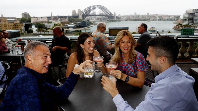 Cafe Sydney patrons, from left, Derek, Jemma, Christina and Jae Glover take in the prized view of Sydney Harbour Bridge on Monday. Picture: Nikki Short