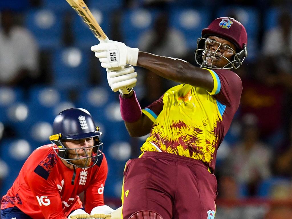 Sherfane Rutherford swings for the fences. Picture: Randy Brooks / AFP