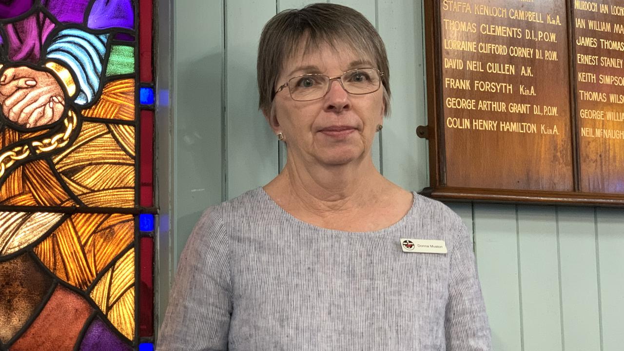 Doona Muston from Rockhampton stands by the entrance wall of St Paul’s Uniting Church on Saturday. Picture: Duncan Evans