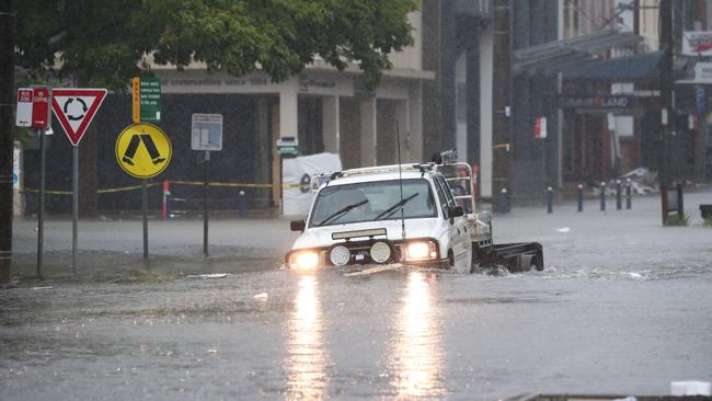 Flooded scenes in Molesworth St, Lismore, NSW, Wednesday , March 30, 2022. Heavy overnight rain has again forced the evacuation of residents in Lismore in northern NSW as the mayor says the town centre is headed for inundation. (AAP Image/Jason O'Brien) NO ARCHIVING