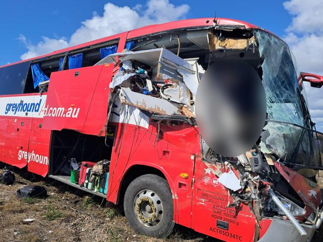 Photographs taken in the immediate aftermath of a horror fatal Greyhound passenger bus crash at Gumlu on the Bruce Highway south of Ayr on Sunday. The bus driver, picture, miraculously survived. The bus carrying 33 passengers was travelling north when it collided head on with a caravan being towed by a four-wheel drive driven by an elderly couple. Three passengers on the bus were killed while two others remained in critical conditions in Townsville University Hospital on Monday morning. Picture: Supplied