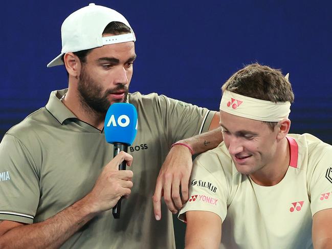 MELBOURNE, AUSTRALIA - JANUARY 07: Matteo Berrettini of Italy interviews Casper Ruud of Norway during the Red Bull Bassline match between Holger Rune of Denmark and Fabian Marozsan of Hungary ahead of the 2025 Australian Open at Melbourne Park on January 07, 2025 in Melbourne, Australia. (Photo by Kelly Defina/Getty Images)