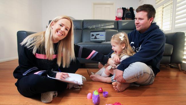 Brittney and Ryan Wohling with their daughter Remi. Picture: Aaron Francis