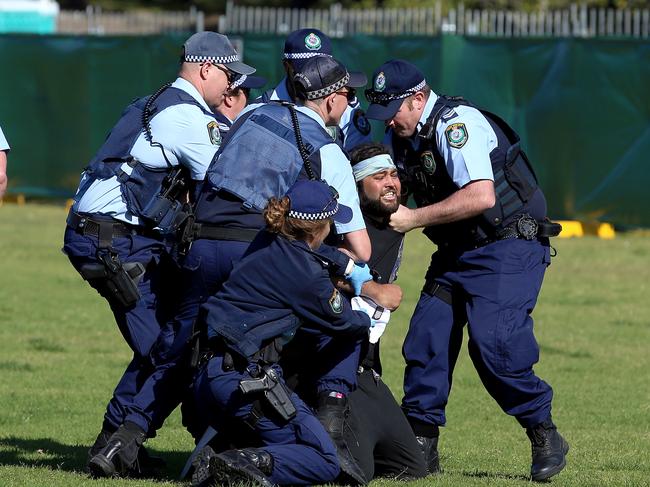 Police arrest a man at the Listen Out music festival in Centennial Park. Picture: Sam Ruttyn